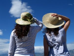 2 Women with hats on a sunny day